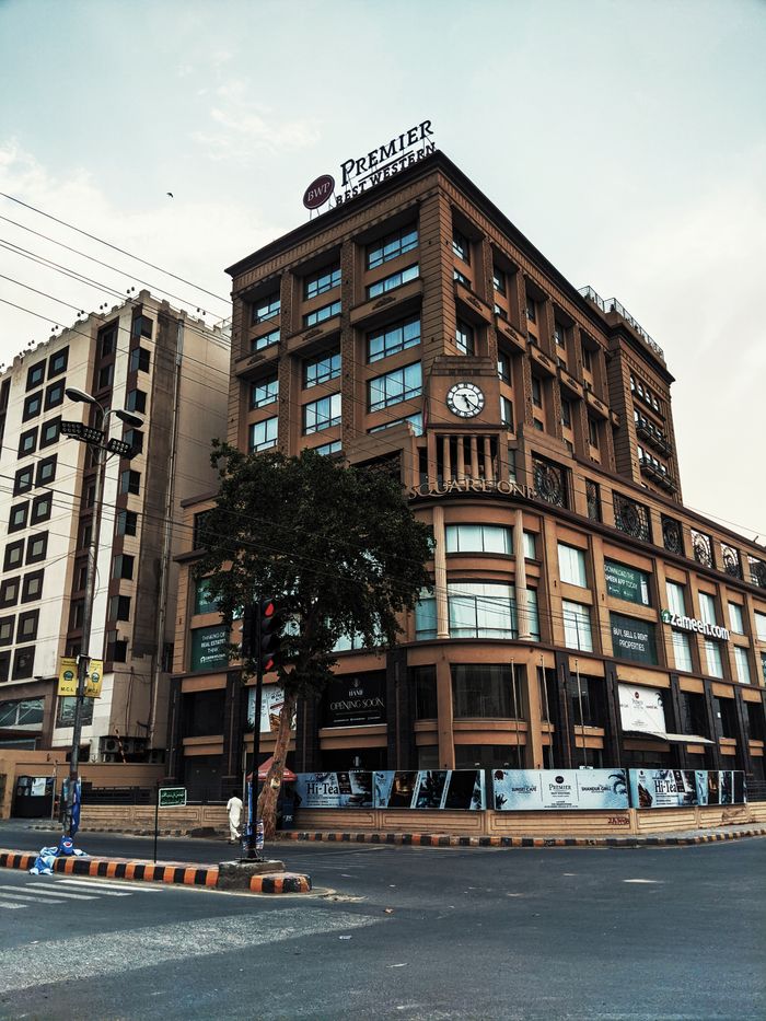 A striking view of the Premier hotel facade in Lahore, showcasing urban architecture.